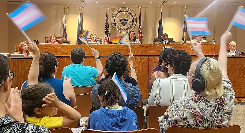 Attendees celebrate and wave their flags as the Delaware County Council votes 5-0 to make Delco a safe haven for the LGBTQ+ community. (Courtesy of Delaware County Council)
