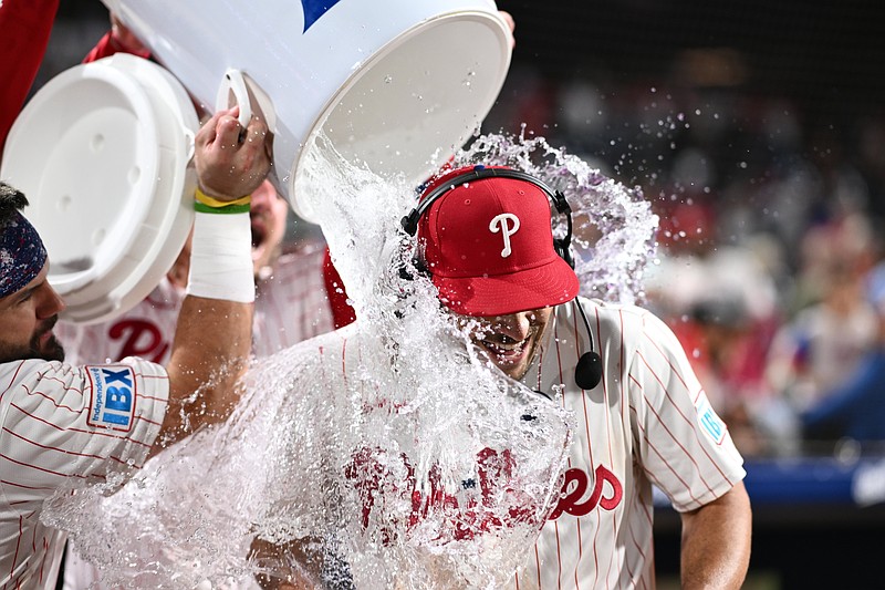 Jun 9, 2025; Philadelphia, Pennsylvania, USA; Philadelphia Phillies infielder Otto Kemp (4) is showered by teammates after the game against the Chicago Cubs at Citizens Bank Park. Mandatory Credit: Kyle Ross-Imagn Images