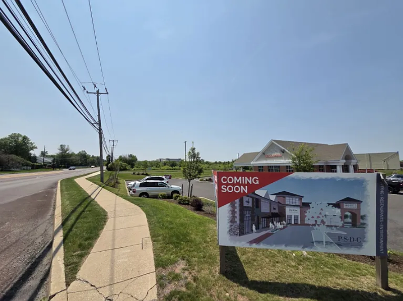 The now-vacant former SKF Inc. building can be seen behind a Wells Fargo bank branch adjacent to a near-vacant shopping center on Forty Foot Road in Towamencin on Wednesday, June 4, 2025.