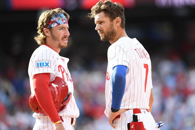 Mar 31, 2025; Philadelphia, Pennsylvania, USA;  Philadelphia Phillies second base Bryson Stott (5) and shortstop Trea Turner (7) talk during a pitching change in the seventh inning ]against the Colorado Rockies at Citizens Bank Park. Mandatory Credit: Eric Hartline-Imagn Images