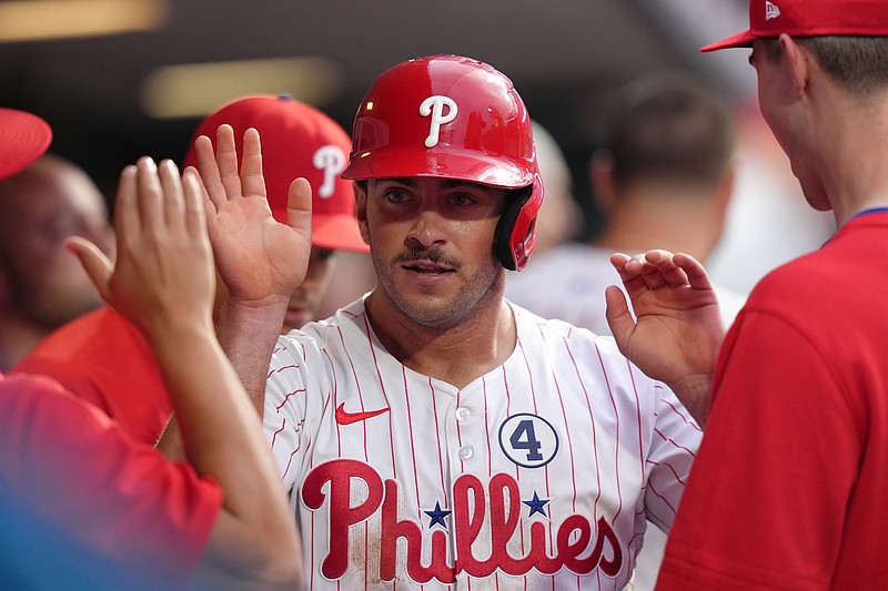Jun 9, 2025; Philadelphia, Pennsylvania, USA; Philadelphia Phillies infielder Otto Kemp (4) celebrates with teammates after scoring a run agianst the Chicago Cubs in the fifth inning at Citizens Bank Park. Mandatory Credit: Kyle Ross-Imagn Images