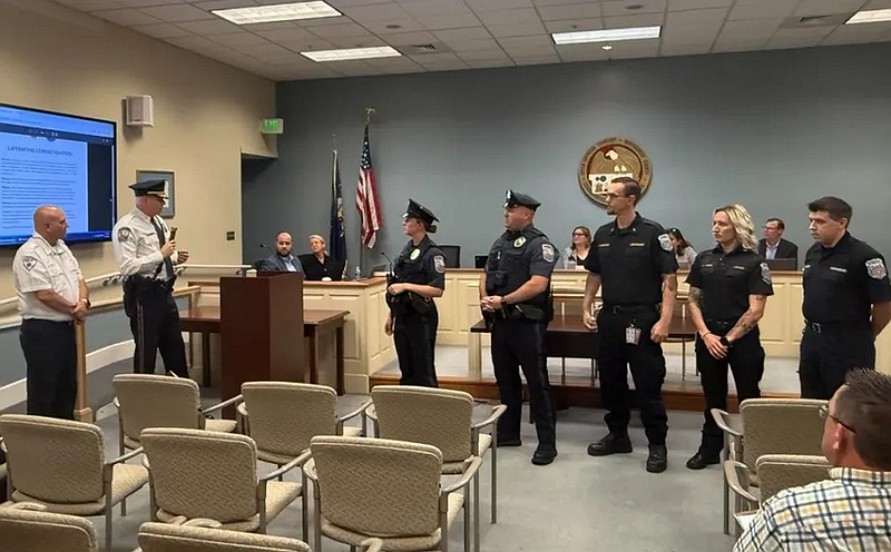Upper Gwynedd police Chief David Duffy, left with microphone, and VMSC-EMS Chief Shane Wheeler congratulate UGPD officers Michael Romanowicz and Amber Welsh and VMSC paramedics Gregory Johns and Abigail Akins and AEMT Roger Shortridge for saving a resident’s life during a medical call in Feb., during the June 9, 2025 township commissioners meeting. (Photo courtesy of Upper Gwynedd Police Department)