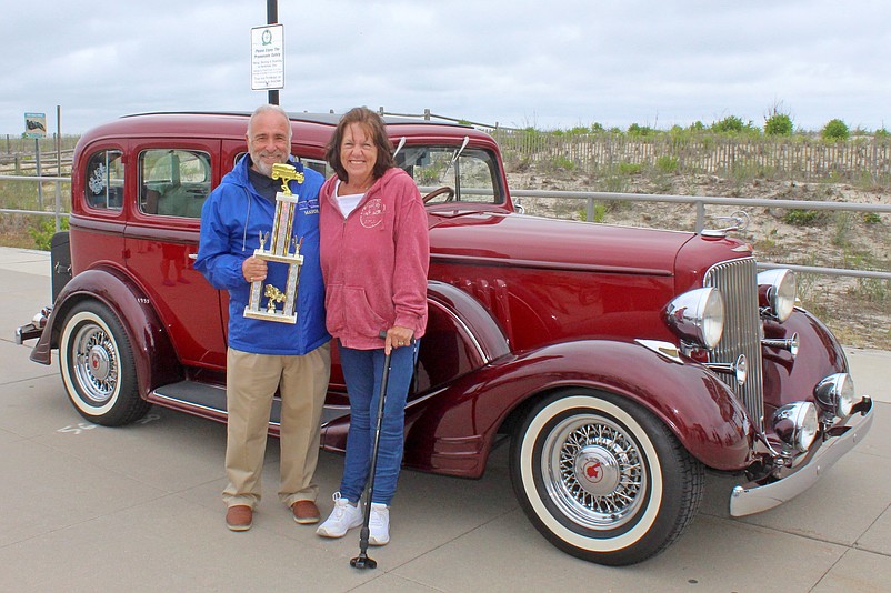 Mayor Leonard Desiderio awards Renee Hopkin, of South Dennis, the “Best of Show” award for her 1933 Pontiac four-door sedan at the 2025 Skimmer Festival Antique Auto Show. (Photo courtesy of Sea Isle City)