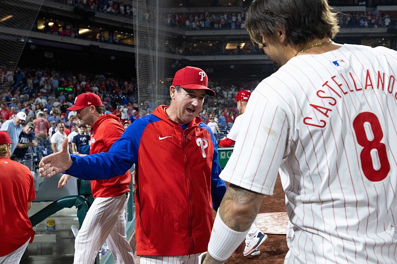 Jun 18, 2024; Philadelphia, Pennsylvania, USA; Philadelphia Phillies manager Rob Thomson congratulates outfielder Nick Castellanos (8) after his walk off RBI double ninth inning against the San Diego Padres at Citizens Bank Park. Mandatory Credit: Bill Streicher-USA TODAY Sports