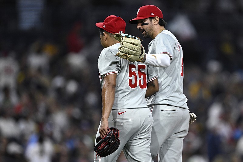 Apr 27, 2024; San Diego, California, USA; Philadelphia Phillies starting pitcher Ranger Suarez (55) is embraced by right fielder Nick Castellanos (8) after pitching the eighth inning against the San Diego Padres at Petco Park. Mandatory Credit: Orlando Ramirez-USA TODAY Sports