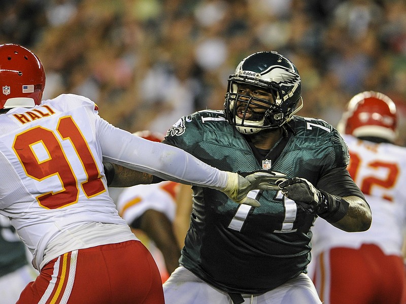 Sep 19, 2013; Philadelphia, PA, USA; Philadelphia Eagles tackle Jason Peters (71) battles with Kansas City Chiefs outside linebacker Tamba Hali (91) during the game at Lincoln Financial Field. Mandatory Credit: John Geliebter-USA TODAY Sports