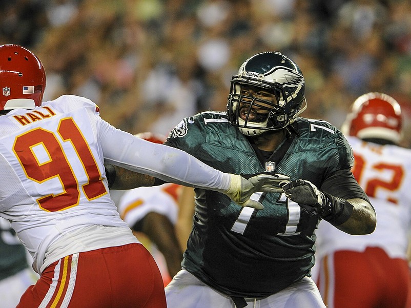 Sep 19, 2013; Philadelphia, PA, USA; Philadelphia Eagles tackle Jason Peters (71) battles with Kansas City Chiefs outside linebacker Tamba Hali (91) during the game at Lincoln Financial Field. Mandatory Credit: John Geliebter-USA TODAY Sports