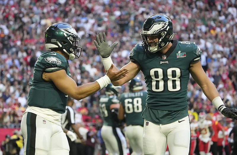 Feb 12, 2023; Glendale, AZ, USA; Philadelphia Eagles quarterback Jalen Hurts (1) celebrates with tight end Dallas Goedert (88) after scoring a touchdown against the Kansas City Chiefs during the first quarter in Super Bowl LVII at State Farm Stadium. Mandatory Credit: Michael Chow/The Republic via USA TODAY Sports