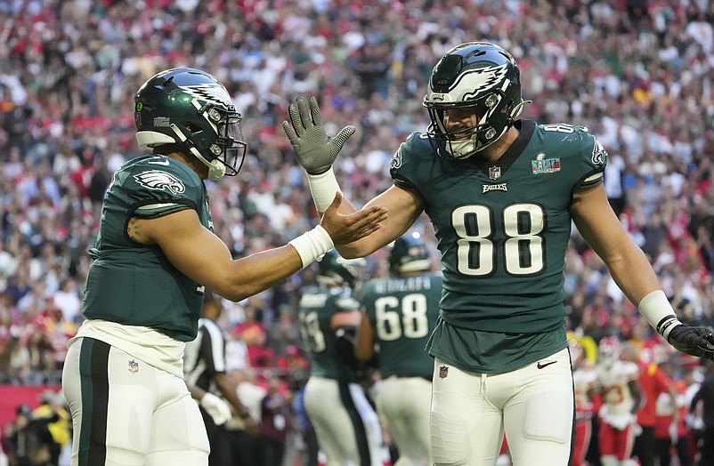 Feb 12, 2023; Glendale, AZ, USA; Philadelphia Eagles quarterback Jalen Hurts (1) celebrates with tight end Dallas Goedert (88) after scoring a touchdown against the Kansas City Chiefs during the first quarter in Super Bowl LVII at State Farm Stadium. Mandatory Credit: Michael Chow/The Republic via USA TODAY Sports