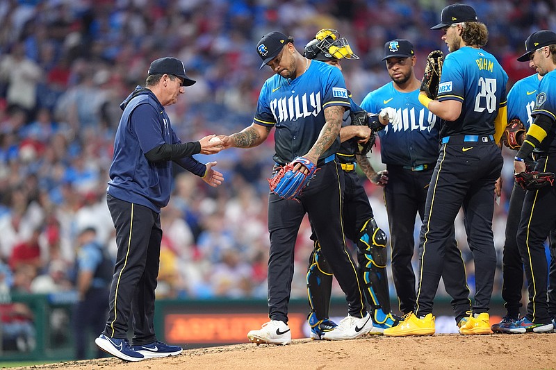 May 30, 2025; Philadelphia, Pennsylvania, USA; Philadelphia Phillies starting pitcher Taijuan Walker (99) reacts after being removed from the game by manager Rob Thomson (59) against the Milwaukee Brewers in the fifth inning at Citizens Bank Park. Mandatory Credit: Kyle Ross-Imagn Images