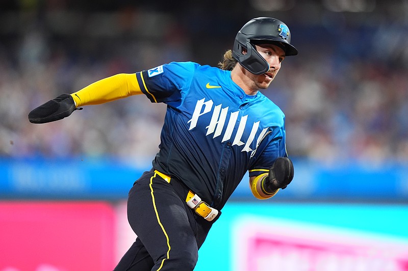 Jun 13, 2025; Philadelphia, Pennsylvania, USA; Philadelphia Phillies infielder Bryson Stott (5) rounds third base to advance home and score against the Toronto Blue Jays in the eighth inning at Citizens Bank Park. Mandatory Credit: Kyle Ross-Imagn Images