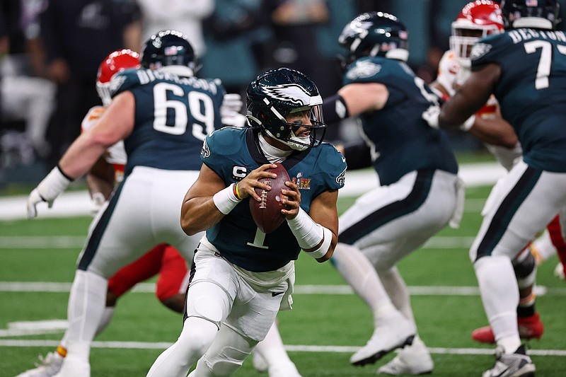 Feb 9, 2025; New Orleans, LA, USA; Philadelphia Eagles quarterback Jalen Hurts (1) looks to pass the ball against the Kansas City Chiefs during the first half of Super Bowl LIX at Caesars Superdome. Mandatory Credit: Bill Streicher-Imagn Images