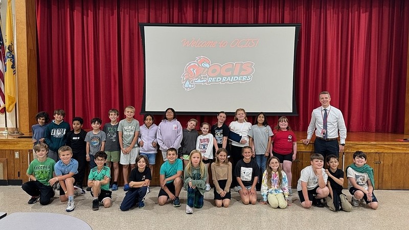 Ocean City Intermediate School Principal Matthew Engle and the students pose for a group photo during the school tour. (Courtesy of Ocean City school district)