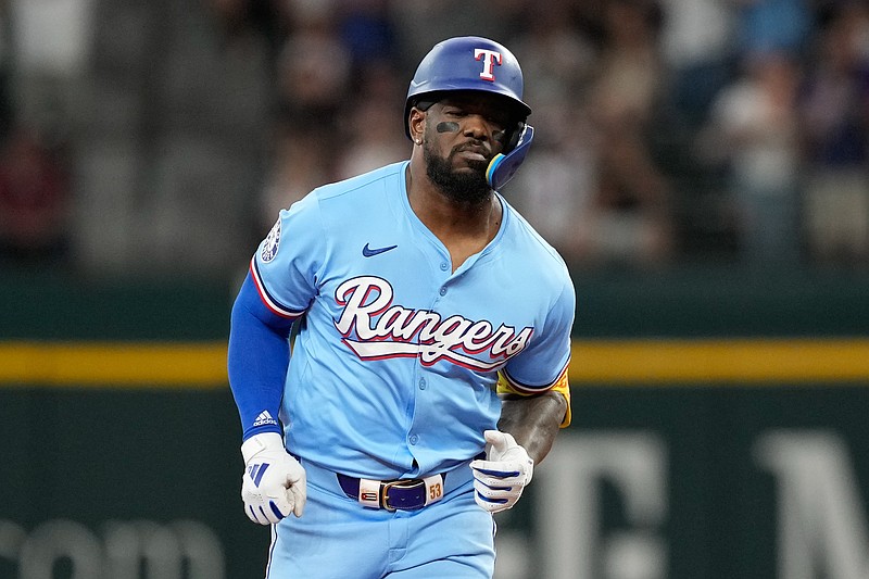 Apr 28, 2024; Arlington, Texas, USA; Texas Rangers right fielder Adolis Garcia (53) rounds the bases on his two-run home run against the Cincinnati Reds during the first inning at Globe Life Field. Mandatory Credit: Jim Cowsert-USA TODAY Sports