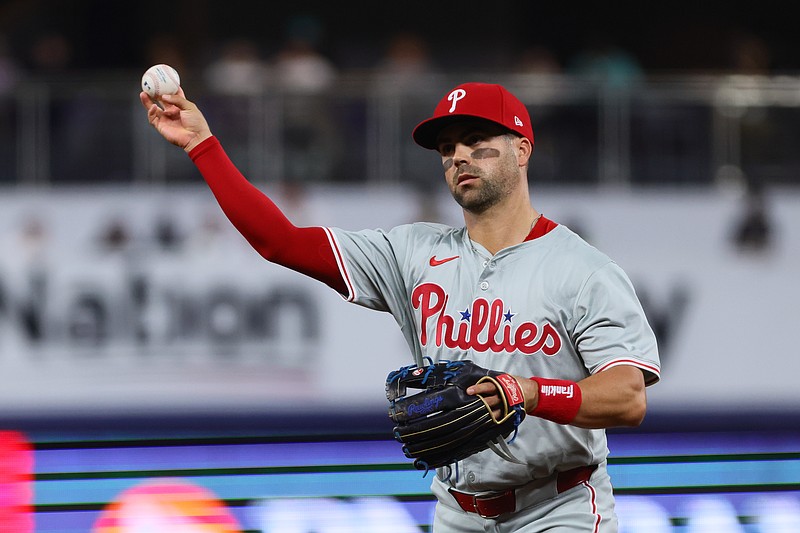May 10, 2024; Miami, Florida, USA; Philadelphia Phillies second baseman Whit Merrifield (9) throws to first base to retire Miami Marlins center fielder Jazz Chisholm Jr. (not pictured) during the second inning at loanDepot Park. Mandatory Credit: Sam Navarro-USA TODAY Sports