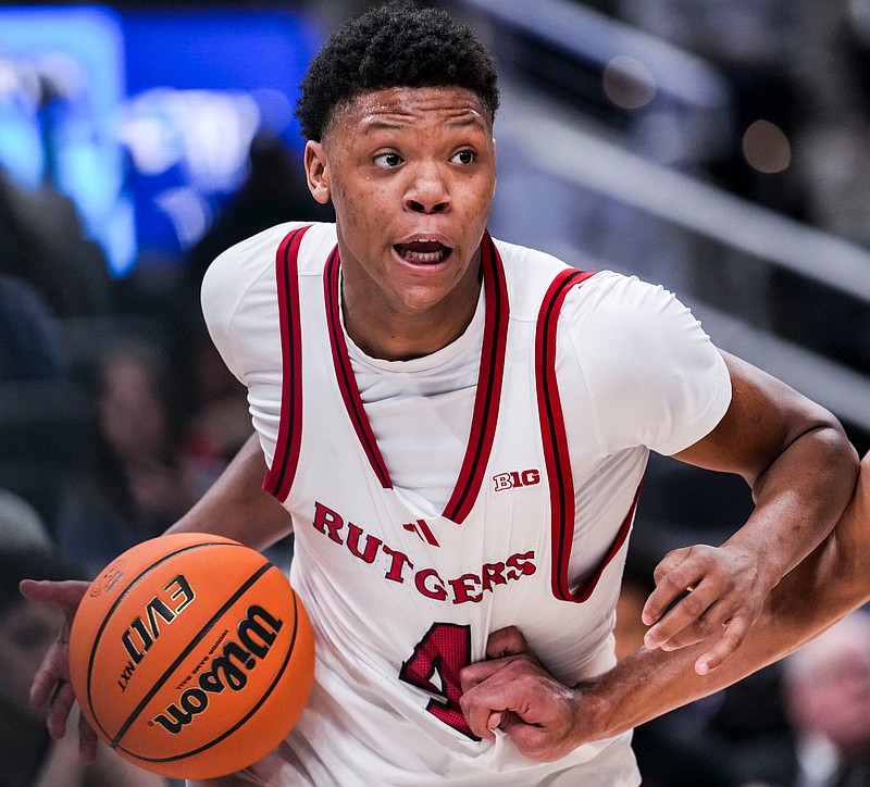 Rutgers Scarlet Knights guard Ace Bailey (4) runs a play Wednesday, March 12, 2025, in a first round game at the 2025 TIAA Big Ten Men’s Basketball Tournament between the USC Trojans and the Rutgers Scarlet Knights at Gainbridge Fieldhouse in Indianapolis. The Hawkeyes defeated the Buckeyes, 77-70.