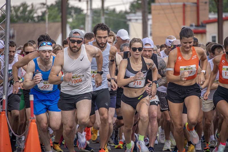 Runners including, from left, Robert Stianchi, 42, Matthew Mueller, 41, Gypsy Cooper, 27, and Mikaela Vlasic, 25, take part in the Tex Mex 5K Race for Open Space