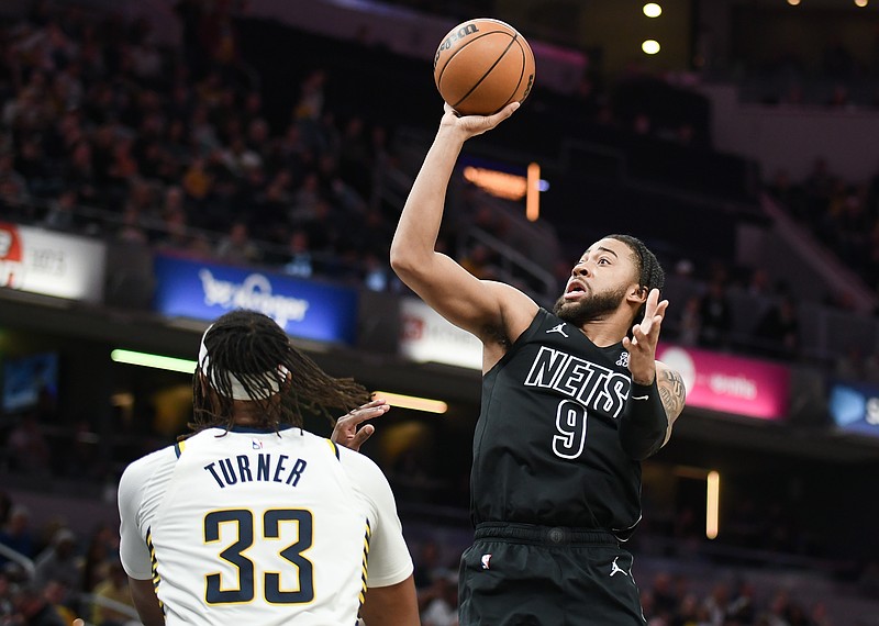 Mar 22, 2025; Indianapolis, Indiana, USA; Brooklyn Nets forward Trendon Watford (9) shoots over Indiana Pacers center Myles Turner (33) during the second half at Gainbridge Fieldhouse. Mandatory Credit: Robert Goddin-Imagn Images