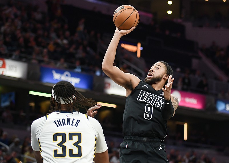 Mar 22, 2025; Indianapolis, Indiana, USA; Brooklyn Nets forward Trendon Watford (9) shoots over Indiana Pacers center Myles Turner (33) during the second half at Gainbridge Fieldhouse. Mandatory Credit: Robert Goddin-Imagn Images