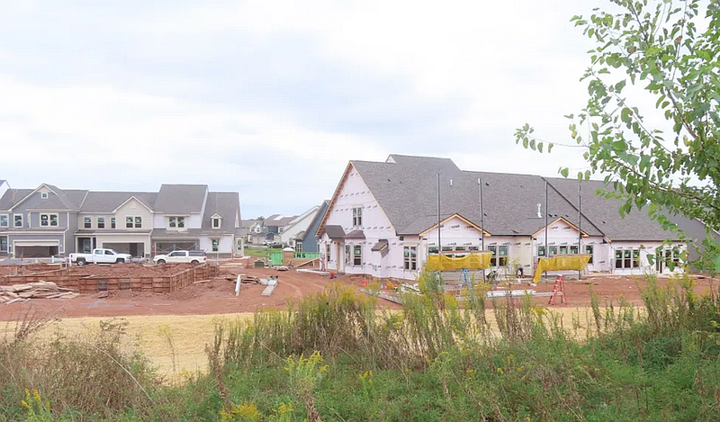 Crews put the finishing touches on a complex of townhouses in a development on Forty Foot Road in Hatfield Township in fall 2024.