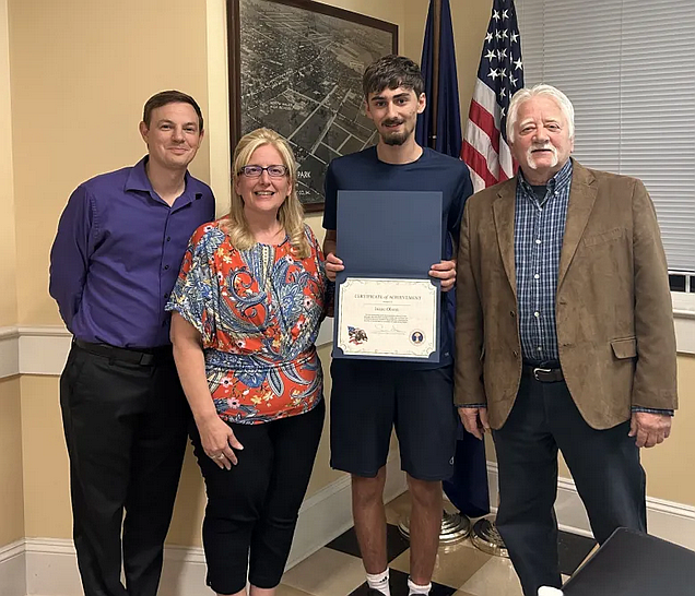 Local Boy Scout Isaac Rosen, third from left, was honored by North Wales Borough officials during their Oct. 22, 2024 meeting for creating an inventory of shade trees in the town’s Ward 1. From left to right are assistant Manager Alex Turock, borough Manager Christine Hart, Rosen, and council President Sal Amato. (Credit: North Wales Borough)