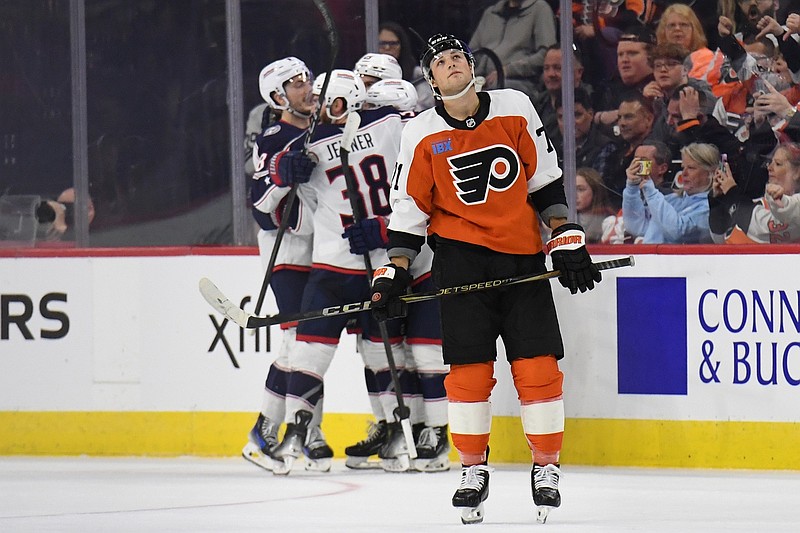Apr 15, 2025; Philadelphia, Pennsylvania, USA; Philadelphia Flyers right wing Tyson Foerster (71) skates back to the bench as Columbus Blue Jackets celebrate a goal during the second period at Wells Fargo Center. Mandatory Credit: Eric Hartline-Imagn Images
