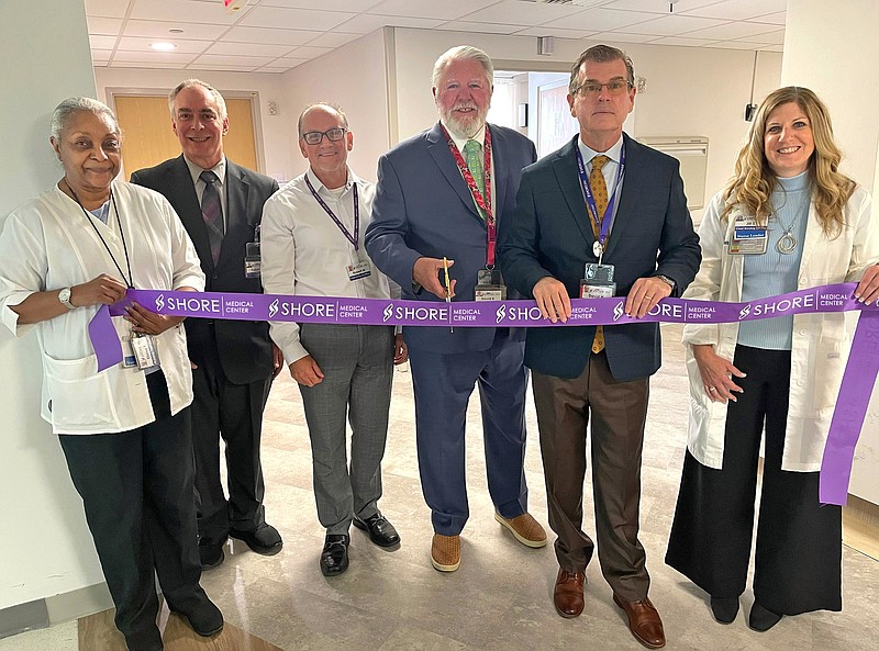 PROVIDED/Shore Medical Center celebrateS the completion of the 4th Whitby unit renovations with an official ribbon cutting. From left, Nurse Manager Elaine Toolsie, Senior Director Logistics Bob Robertson, CFO Rob Wood, Board of Trustees Chairman David Beyel, CEO/President David Hughes, Cheif Nursing Officer Jill Shultz.