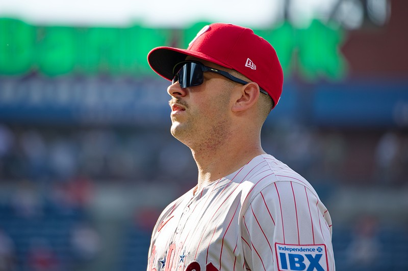 Jul 2, 2025; Philadelphia, Pennsylvania, USA; Philadelphia Phillies infielder Otto Kemp (4) warms up before a game against the San Diego Padres at Citizens Bank Park. (Credit: Grace Del Pizzo-On Pattison)