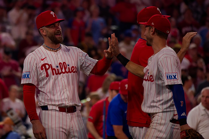 Jul 2, 2025; Philadelphia, Pennsylvania, USA; Philadelphia Phillies first baseman Bryce Harper (3) congratulates shortstop Trea Turner (7) after their win against the San Diego Padres at Citizens Bank Park. (Credit: Grace Del Pizzo-On Pattison)