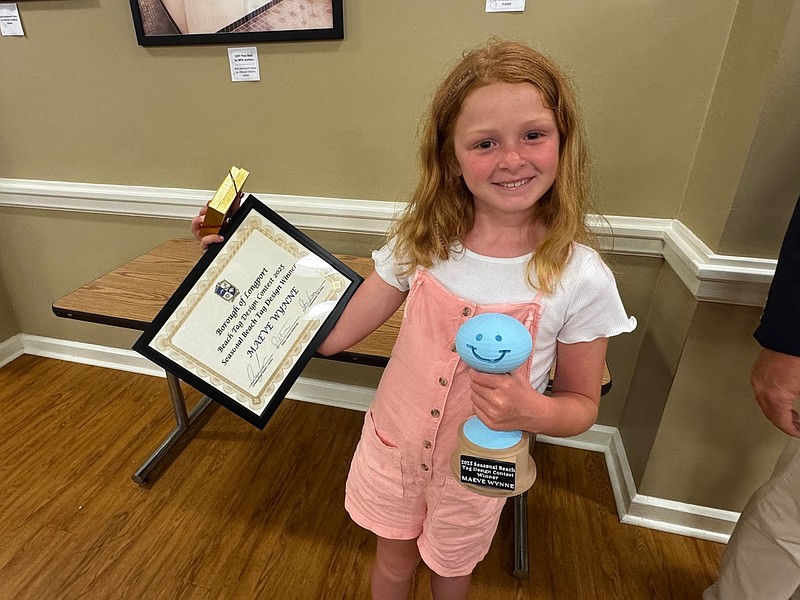 Maeve Wynne won for her seasonal beach tag design