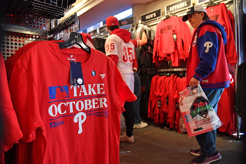 Oct 11, 2023; Philadelphia, Pennsylvania, USA; Fans shop for official MLB postseason merchandise. (Credit: © Eric Hartline-Imagn Images)