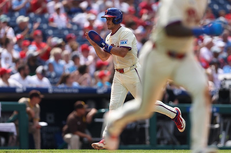 Jul 2, 2025; Philadelphia, Pennsylvania, USA; Philadelphia Phillies catcher J.T. Realmuto (10) claps his hands as he runs home for a score against the San Diego Padres during the seventh inning at Citizens Bank Park. Mandatory Credit: Bill Streicher-Imagn Images