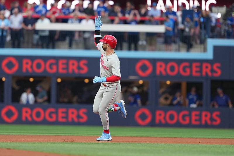 Jun 3, 2025; Toronto, Ontario, CAN; Philadelphia Phillies first baseman Bryce Harper (3) celebrates after hitting a home run against the Toronto Blue Jays during the first inning at Rogers Centre. Mandatory Credit: Nick Turchiaro-Imagn Images