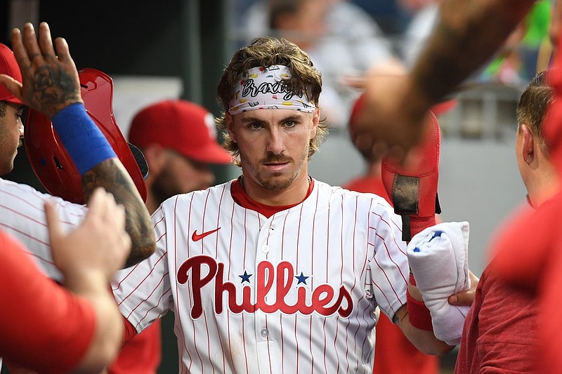 Jun 30, 2025; Philadelphia, Pennsylvania, USA; Philadelphia Phillies second base Bryson Stott (5) celebrates in the dugout after scoring a run during the fourth inning against the San Diego Padres at Citizens Bank Park. Mandatory Credit: Eric Hartline-Imagn Images