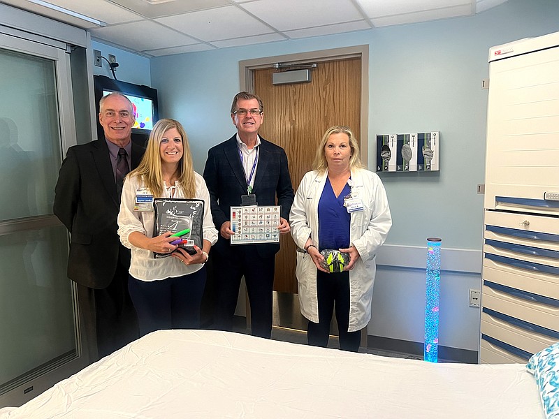 Pictured from left, Bob Robertson, senior director of Logistics, Jill Shultz, chief nursing officer, David Hughes, CEO and president, and Sherri Richmond, administrative director of the Emergency Department, Pediatrics and Respiratory, stand in Shore Medical Center’s newly opened adult sensory-friendly emergency room. (Photo courtesy of Shore Medical Center)