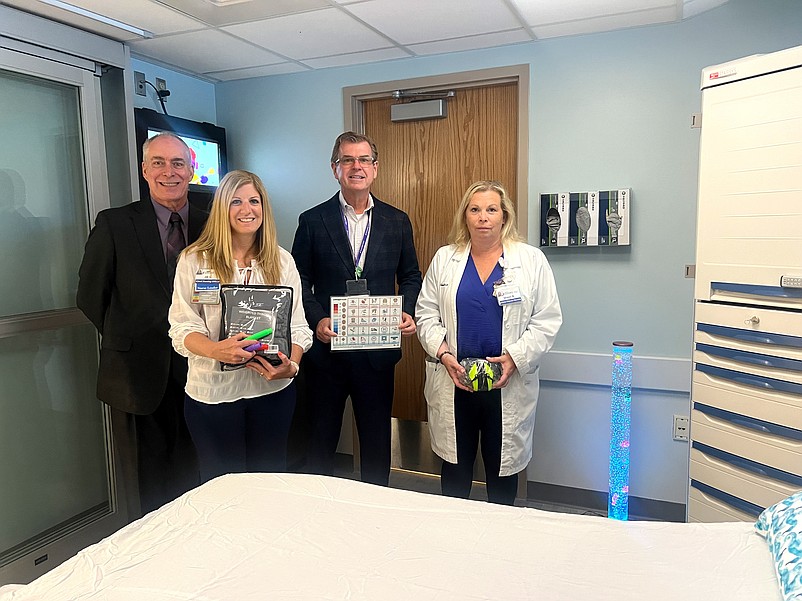 Pictured from left, Bob Robertson, senior director of Logistics, Jill Shultz, chief nursing officer, David Hughes, CEO and president, and Sherri Richmond, administrative director of the Emergency Department, Pediatrics and Respiratory, stand in Shore Medical Center’s newly opened adult sensory-friendly emergency room. (Photo courtesy of Shore Medical Center)
