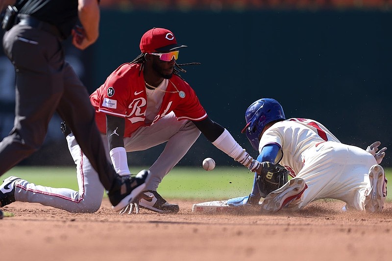 Jul 5, 2025; Philadelphia, Pennsylvania, USA; Philadelphia Phillies shortstop Trea Turner (7) steals second base past the tag attempt of Cincinnati Reds shortstop Elly De La Cruz (44) during the third inning at Citizens Bank Park. Mandatory Credit: Bill Streicher-Imagn Images