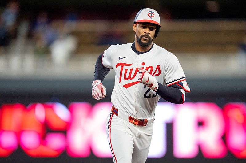 Apr 23, 2025; Minneapolis, Minnesota, USA; Minnesota Twins center fielder Byron Buxton (25) hits a two-run home run off Chicago White Sox pitcher Cam Booser (71) in the seventh inning at Target Field. Mandatory Credit: Matt Blewett-Imagn Images