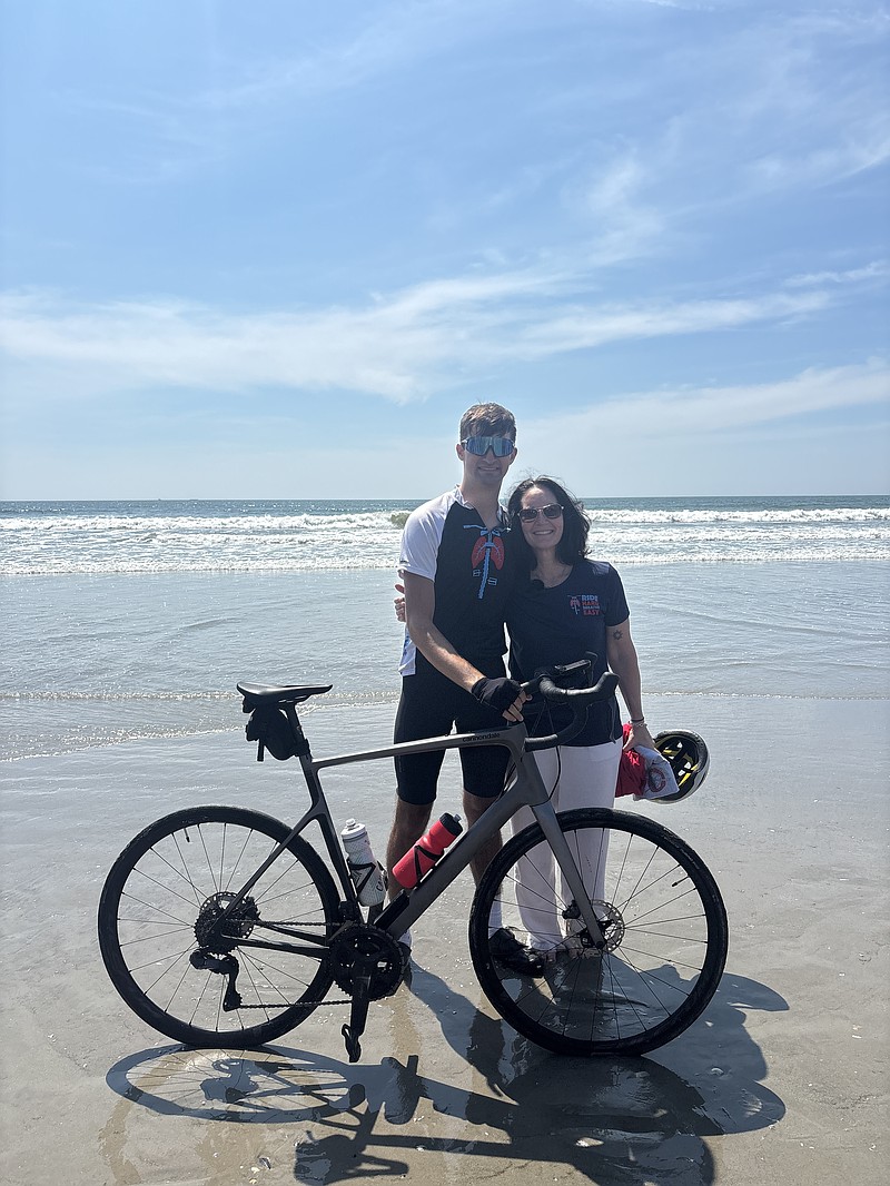 Jack Owens and his mother, Karen Owens, celebrate the completion of his cross-country bike trip on the 34th Street beach in Ocean City. (Photo courtesy of John "Jack" Matthews)