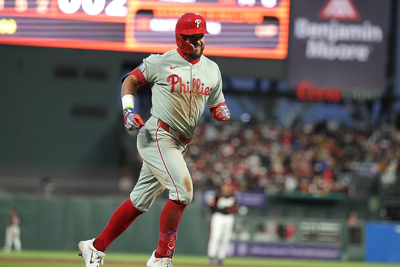 Jul 8, 2025; San Francisco, California, USA; Philadelphia Phillies designated hitter Kyle Schwarber (12) smiles as he runs home on a two-run home run against the San Francisco Giants during the seventh inning at Oracle Park. Mandatory Credit: Kelley L Cox-Imagn Images