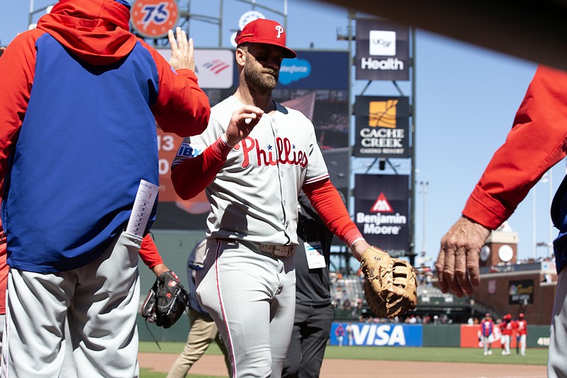 Jul 9, 2025; San Francisco, California, USA; Philadelphia Phillies first baseman Bryce Harper (3) walks off the field following his team’s 13-0 victory over the San Francisco Giants at Oracle Park. Mandatory Credit: D. Ross Cameron-Imagn Images