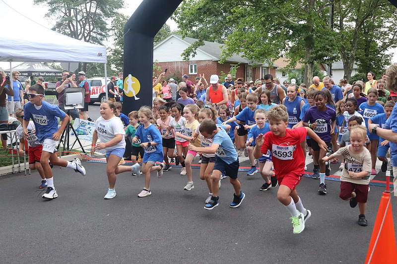 Dozens of children begin the Kids’ 1K Run in Souderton Community Park.