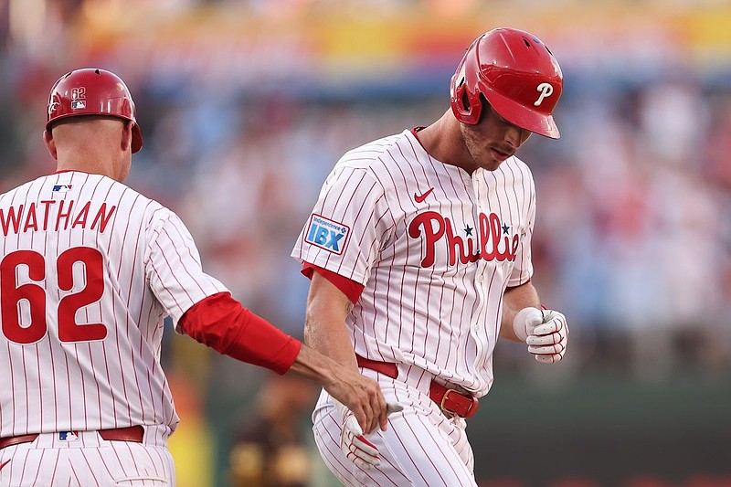 Jul 2, 2025; Philadelphia, Pennsylvania, USA; Philadelphia Phillies outfielder Max Kepler (17) shakes hands with third base coach Dusty Wathan (62) after hitting a two RBI home run during the fourth inning against the San Diego Padres during the fourth inning at Citizens Bank Park. Mandatory Credit: Bill Streicher-Imagn Images