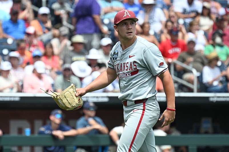 Jun 16, 2025; Omaha, Neb, USA;  Arkansas Razorbacks starting pitcher Gage Wood (14) looks at the scoreboard walking off the mound after the end of the third inning against the Murray State Racers at Charles Schwab Field. Mandatory Credit: Steven Branscombe-Imagn Images