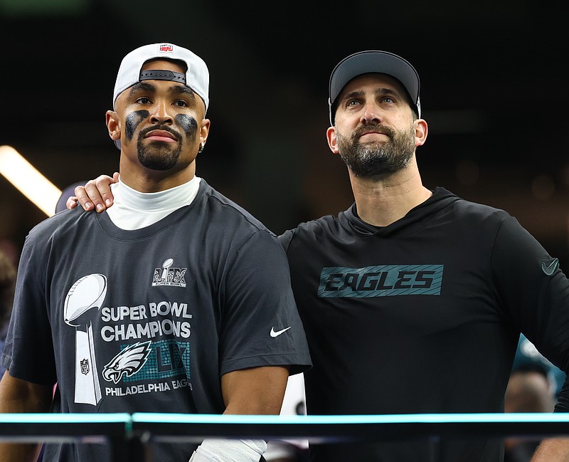 Feb 9, 2025; New Orleans, LA, USA; Philadelphia Eagles head coach Nick Sirianni and Philadelphia Eagles quarterback Jalen Hurts (1) on the podium after defeating the Kansas City Chiefs in Super Bowl LIX at Ceasars Superdome. Mandatory Credit: Mark J. Rebilas-Imagn Images