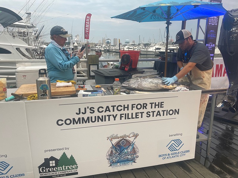 The donations of tournament catches has become a tradition, with a table to fillet the fish. (FILE photo)