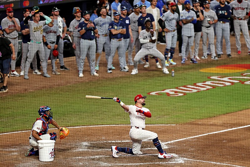 Jul 15, 2025; Cumberland, Georgia, USA;  National League designated hitter Kyle Schwarber (12) of the Philadelphia Phillies hits a home run in the swing off of after the 2025 MLB All Star Game ended in a tie at Truist Park. Mandatory Credit: Jordan Godfree-Imagn Images