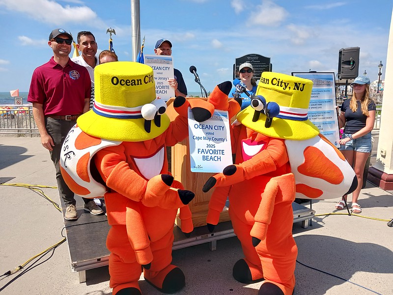 Led by mascots Martin Z. and Mollie Mollusk, Ocean City officials celebrate the win in the New Jersey Sea Grant Consortium "Favorite Beach" contest.