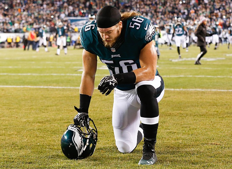 Dec 14, 2014; Philadelphia, PA, USA; Philadelphia Eagles linebacker Bryan Braman (56) kneels before the start of a game against the Dallas Cowboys at Lincoln Financial Field. The Cowboys defeated the Eagles 38-27. Mandatory Credit: Bill Streicher-USA TODAY Sports