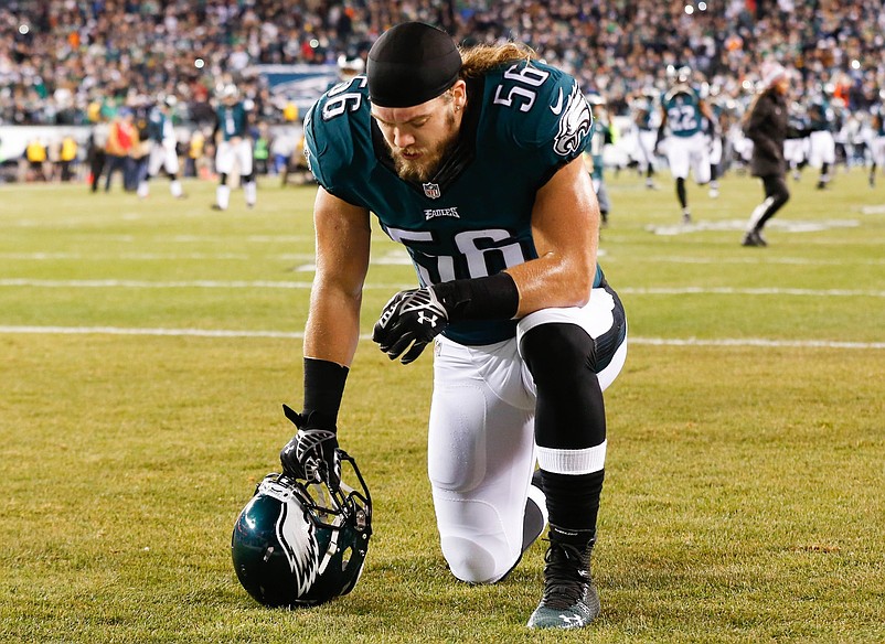 Dec 14, 2014; Philadelphia, PA, USA; Philadelphia Eagles linebacker Bryan Braman (56) kneels before the start of a game against the Dallas Cowboys at Lincoln Financial Field. The Cowboys defeated the Eagles 38-27. Mandatory Credit: Bill Streicher-USA TODAY Sports